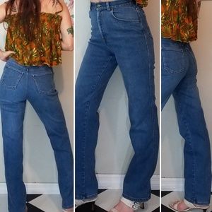 Vintage 1980s orange tab Levi's jeans. High waisted denim with 11” rise.